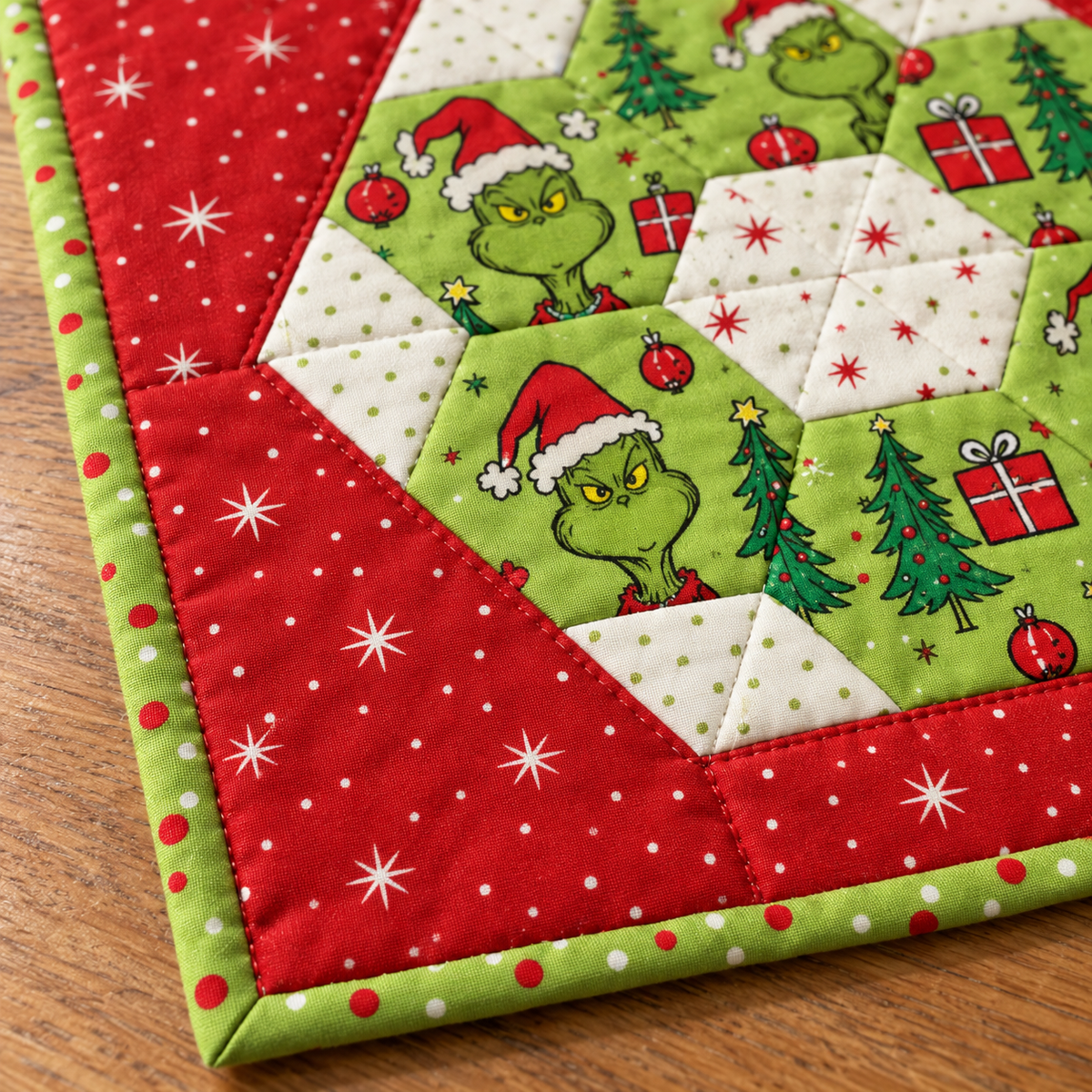 Close-up of lime-green dotted binding and red star-print cotton on the Christmas runner