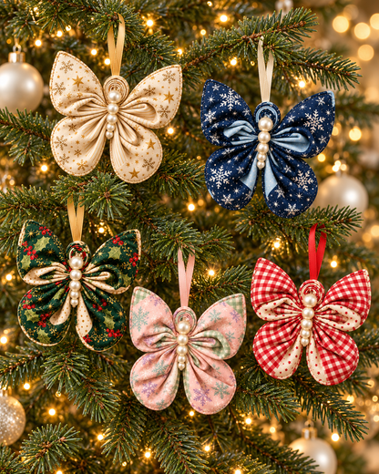 Five handmade pleated fabric butterfly ornaments with pearl bodies hanging on a lit Christmas tree