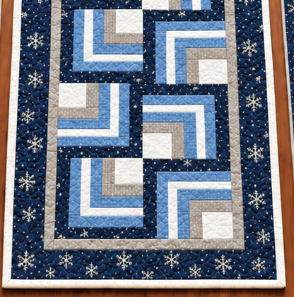 Lower end of the Frosted Snowflake Log Cabin winter table runner showing the navy snowflake border and white binding