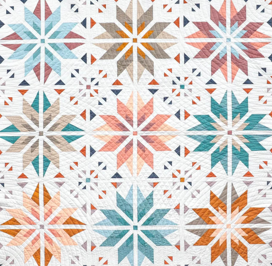 Sweet Creek Quilt Pattern PDF – close-up of star patchwork blocks in teal, orange and pink fat quarters