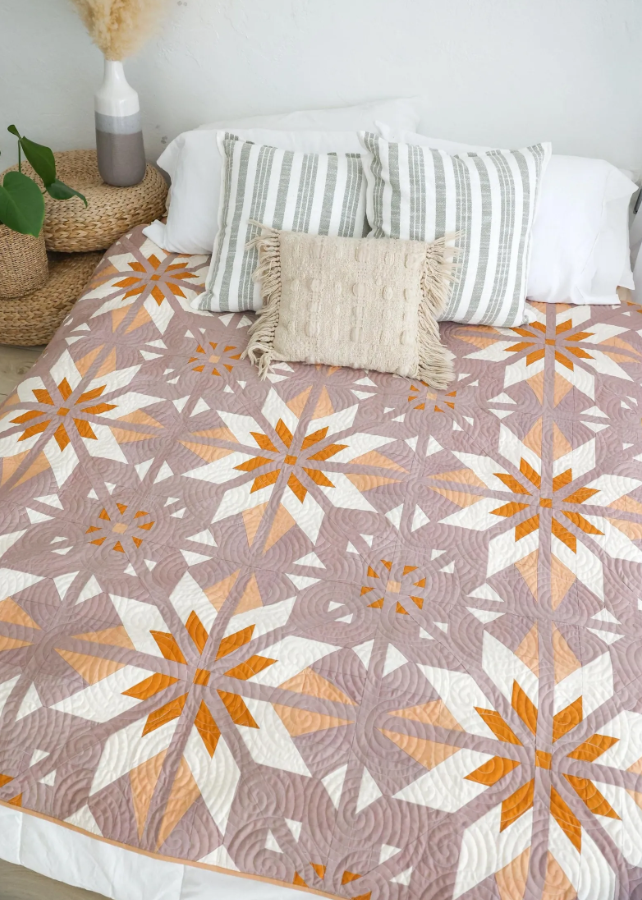 Sweet Creek Quilt Pattern PDF – blush pink star quilt on bed with neutral pillows, modern bedroom decor idea