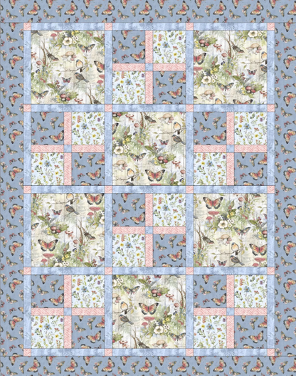 Bluebird Garden Quilt Pattern PDF – flat lay view showing blue border and bird floral patchwork blocks, beginner quilting design