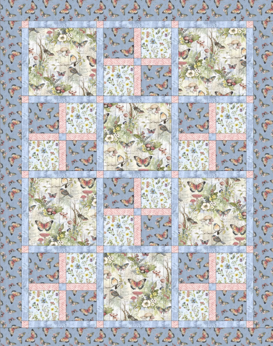 Bluebird Garden Quilt Pattern PDF – flat lay view showing blue border and bird floral patchwork blocks, beginner quilting design