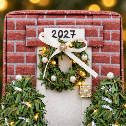 Close-up of the fabric cottage ornament front with wreath and pearl pin details