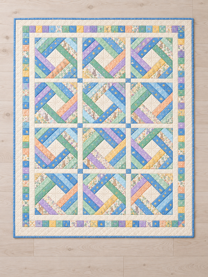 Overhead view of twelve diamond log cabin blocks with ivory sashing and a pastel pieced border