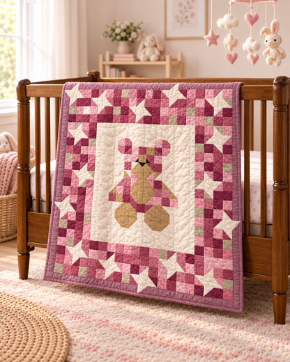 Lullaby Teddy baby quilt pattern PDF, pink patchwork teddy bear quilt with ivory stars draped over a wooden crib in a girl's nursery