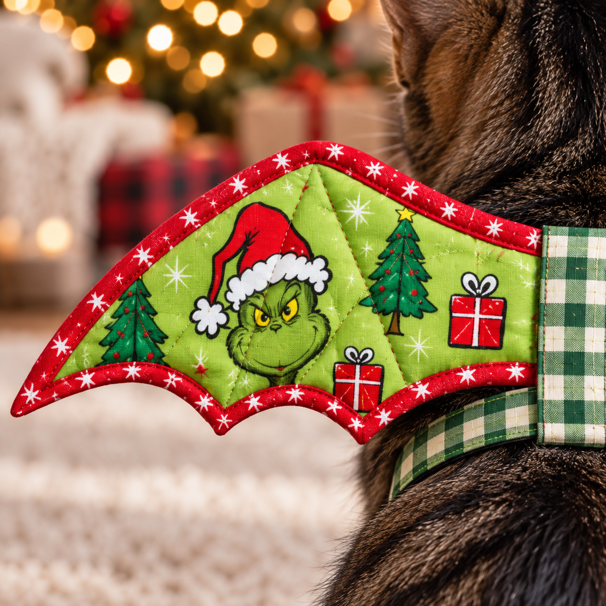 Detail of red star binding, quilting and green holiday print on the cat's bat wing. AI-generated fabric-styling illustration.