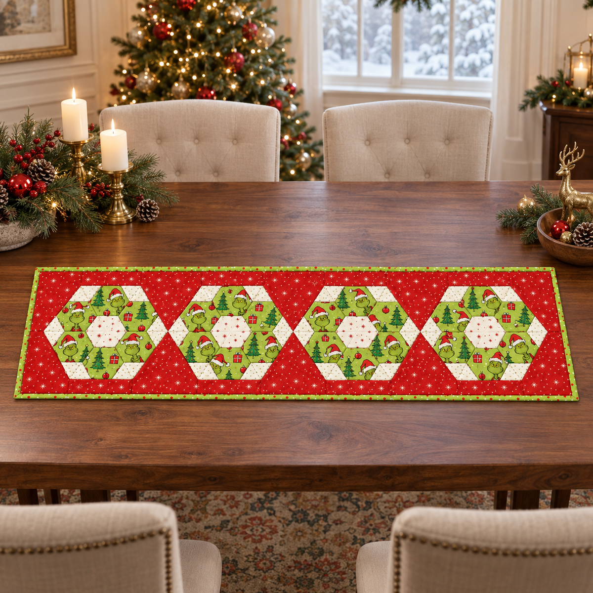 Merry Mischief Christmas table runner with four red and lime-green hexie medallions on an elegant walnut dining table
