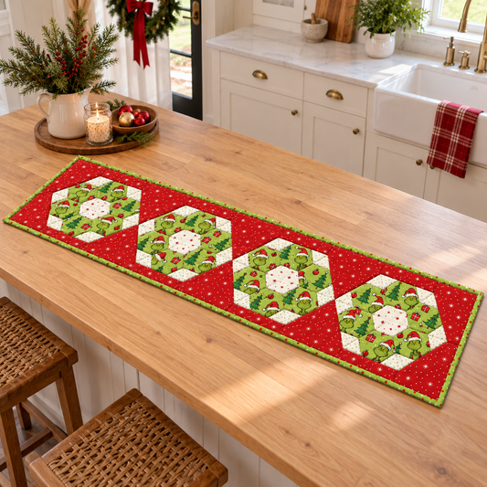 Christmas hexie table runner displayed on a light oak kitchen island
