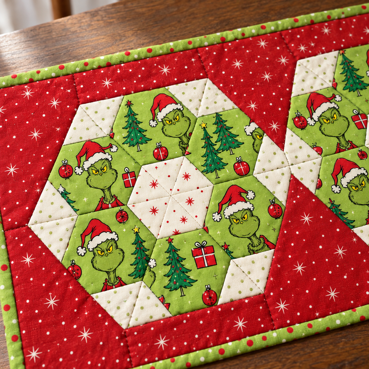 Close-up of one Christmas hexie medallion with printed cotton and pieced ivory center
