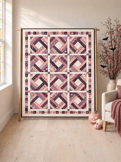 Moonlit Blush Diamond quilt on an oak stand with pink pumpkins and pastel Halloween decor