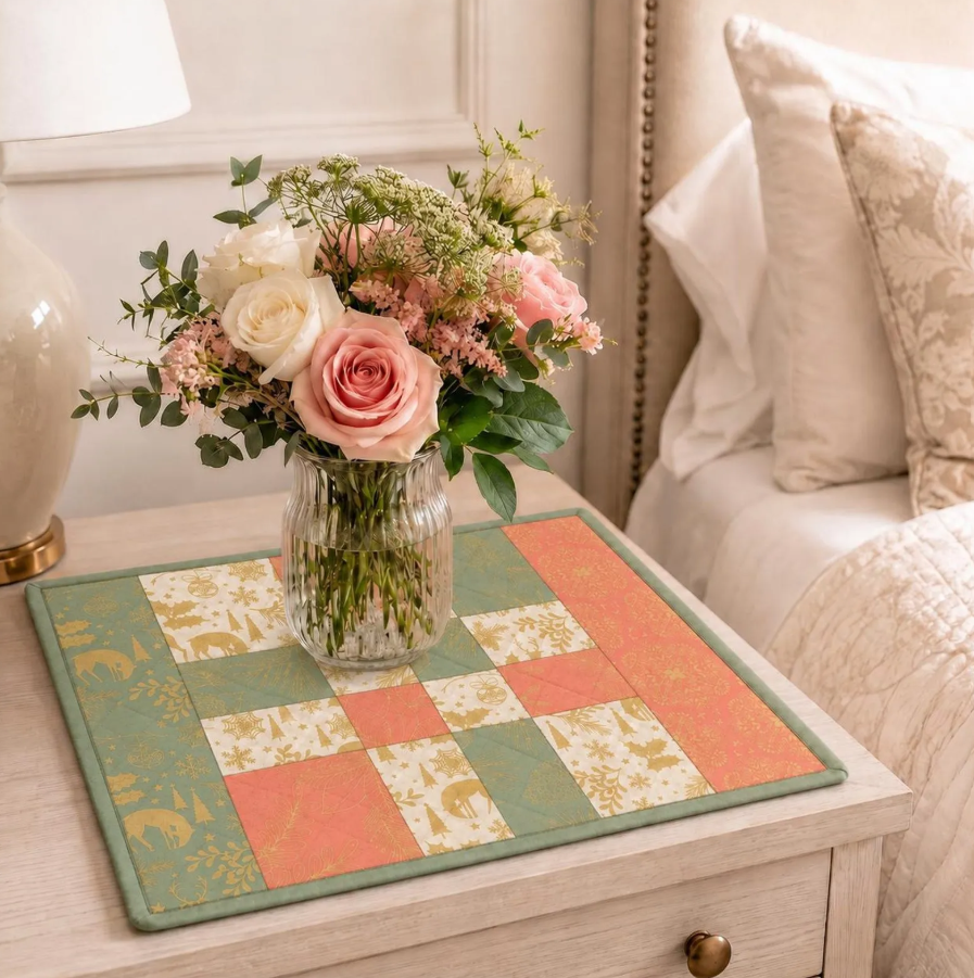 Pastel braided table runner PDF quilt pattern styled on a bright table with soft floral decor