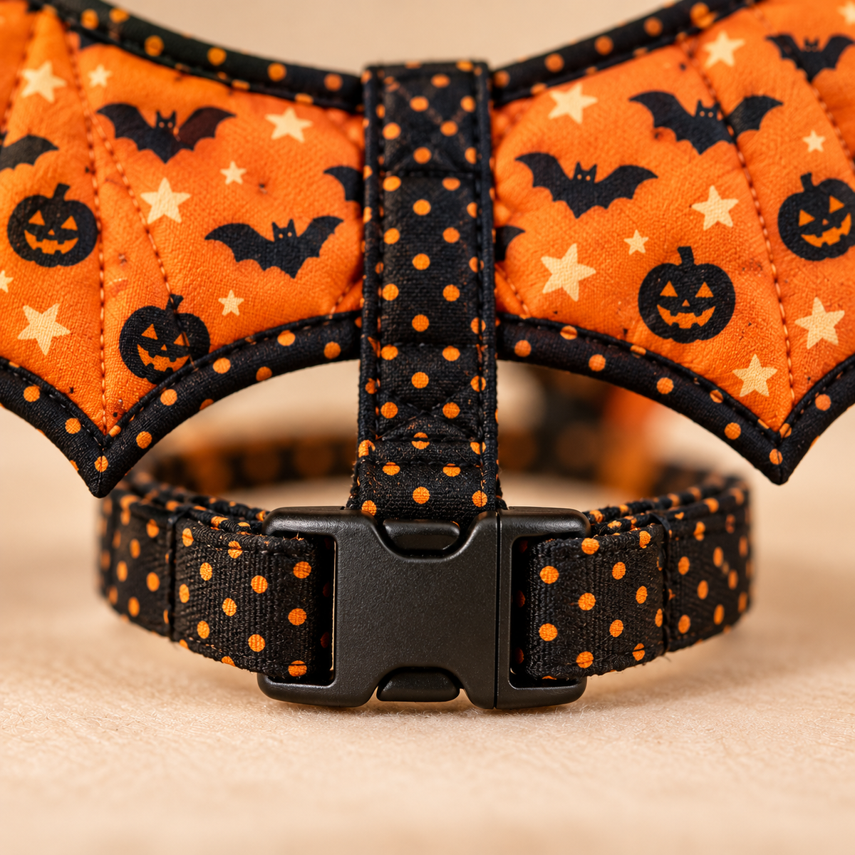 Close-up of the Pumpkin Flight chest strap buckle and reinforced orange-dot fabric strap