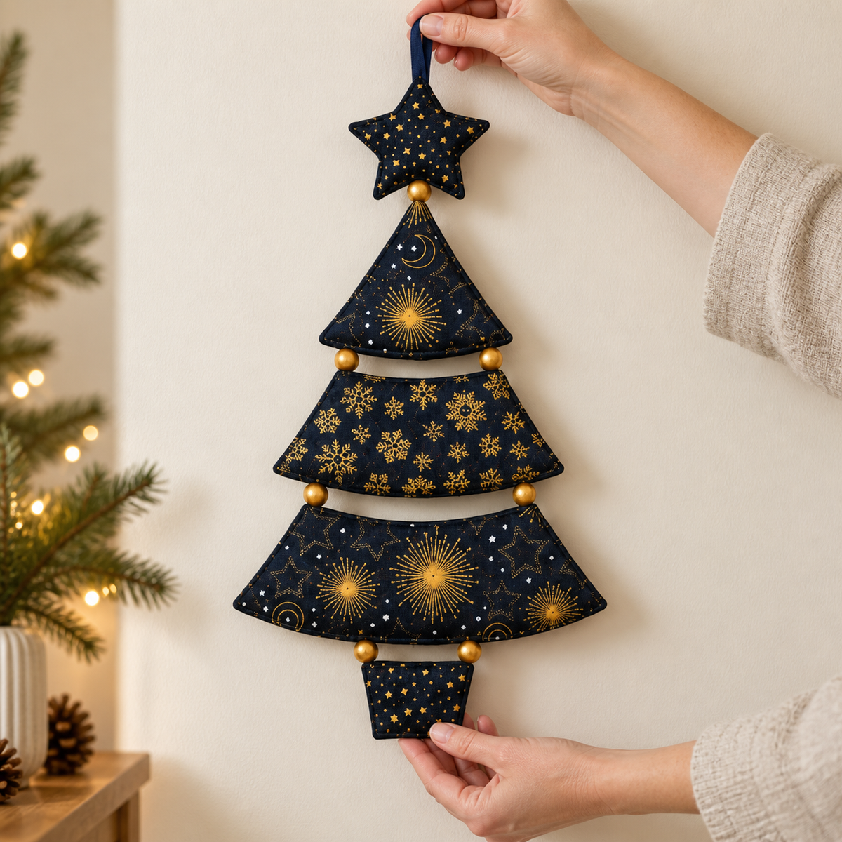 Hand-held Starlit Evergreen fabric tree showing the finished design; AI-generated styling illustration