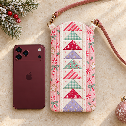 Sugarplum Stroll quilted Christmas phone crossbody bag with pink candy-print sides, a Flying Geese panel and a blush strap