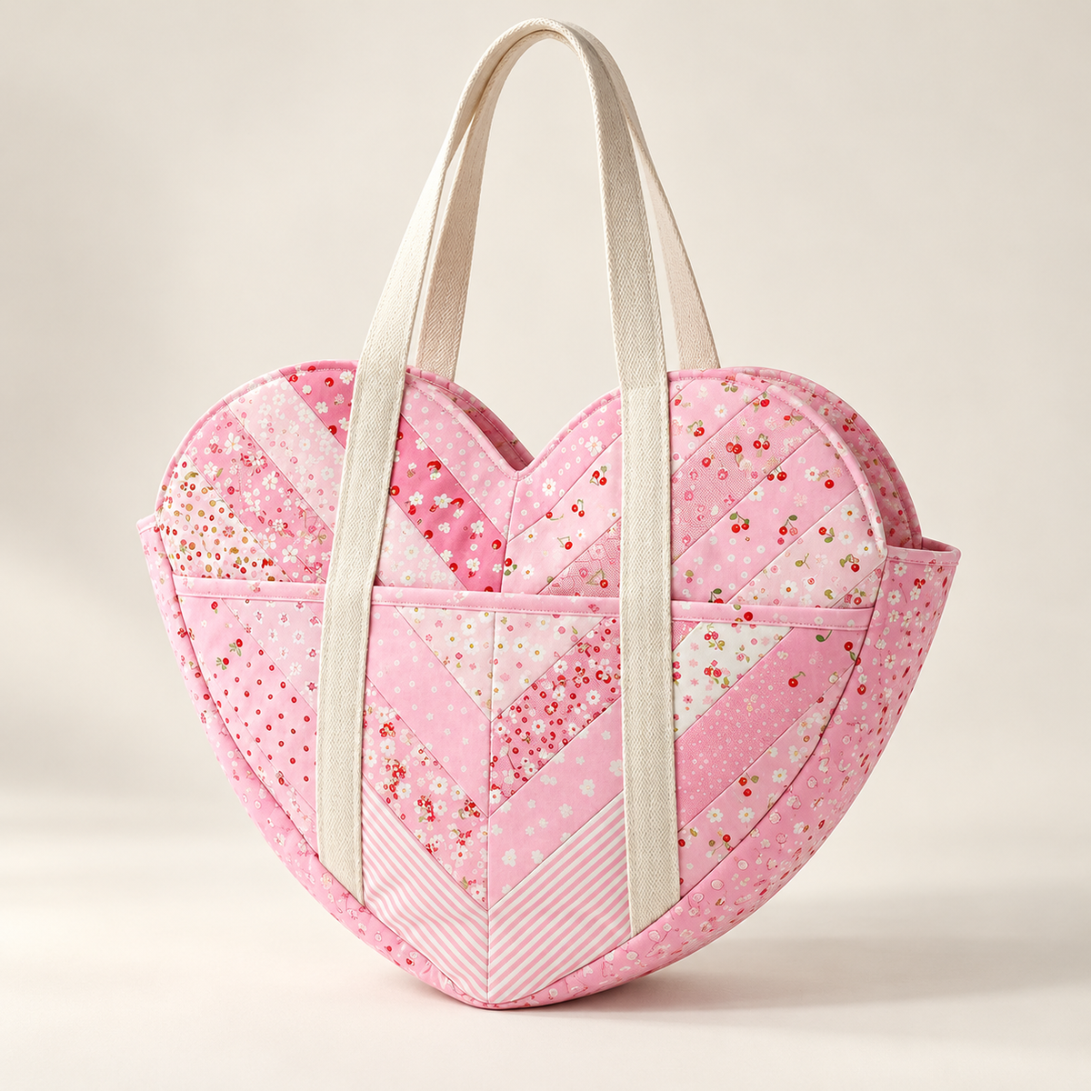Three-quarter view of the Sweetheart patchwork bag showing the heart silhouette, front pocket and pink side panel. AI-generated finished-sample illustration.